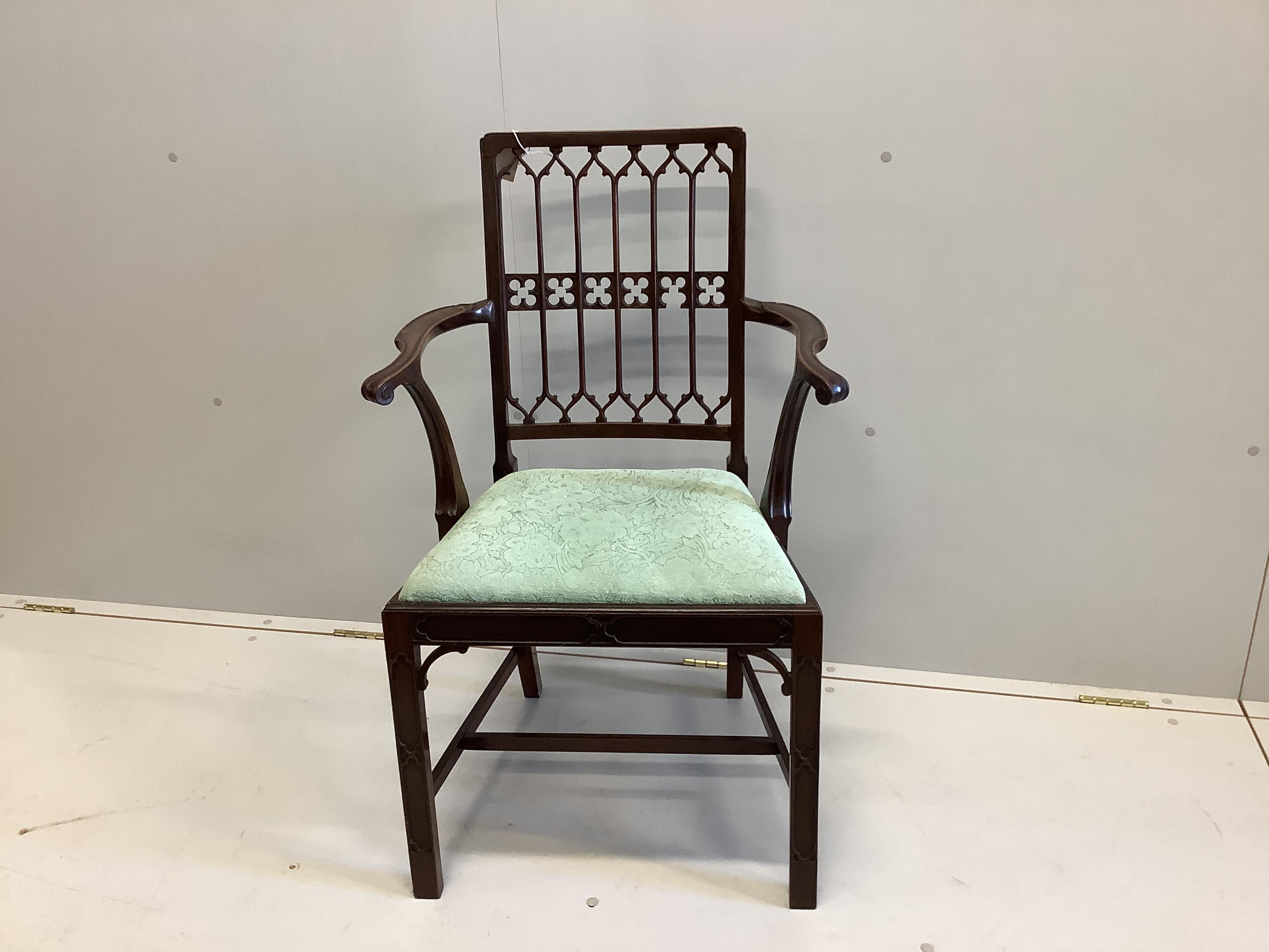 An Edwardian Gothic Revival mahogany elbow chair, width 58cm, depth 42cm, height 95cm